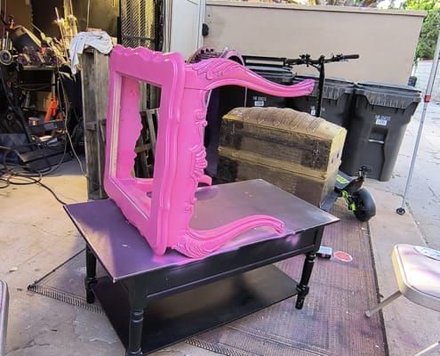 hot pink props end table being painted
